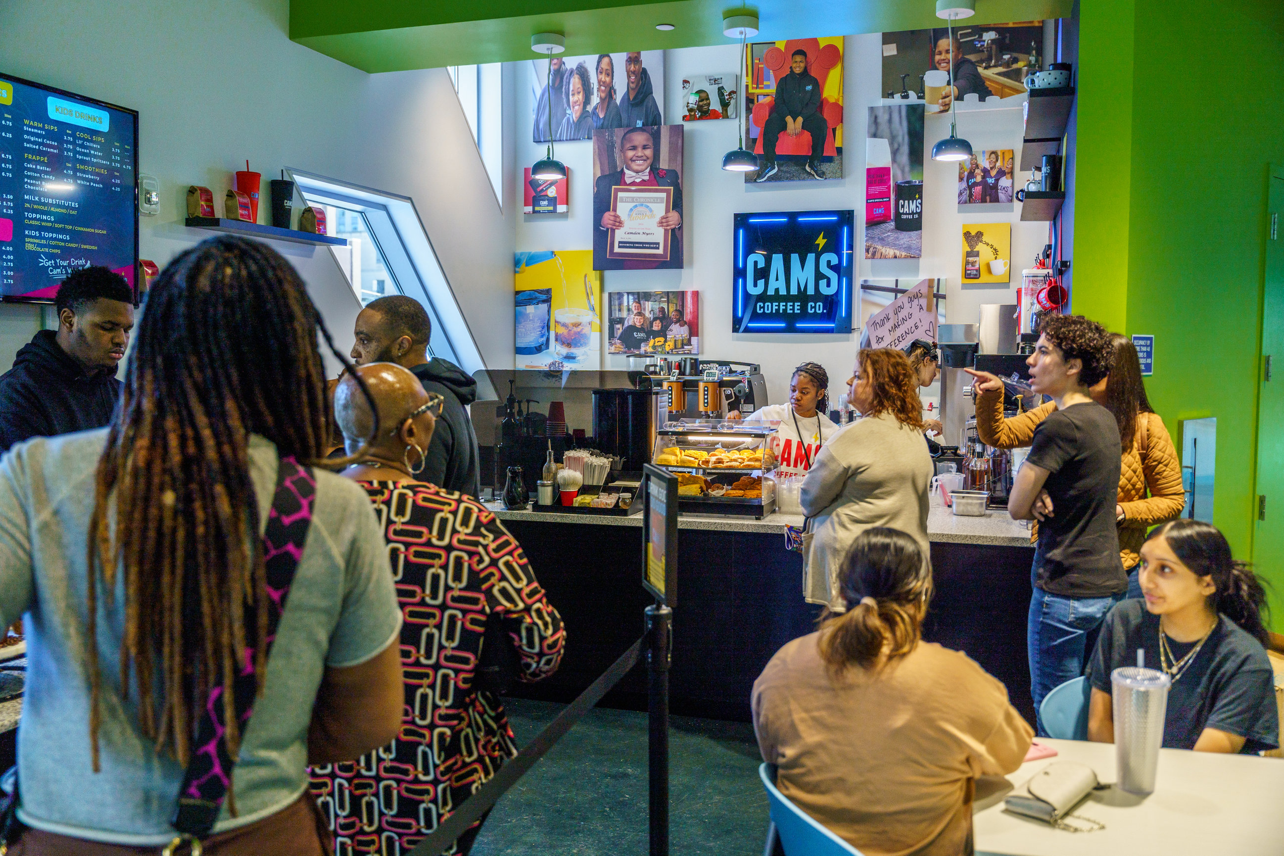 Customers and team members gathered inside Cam's Coffee